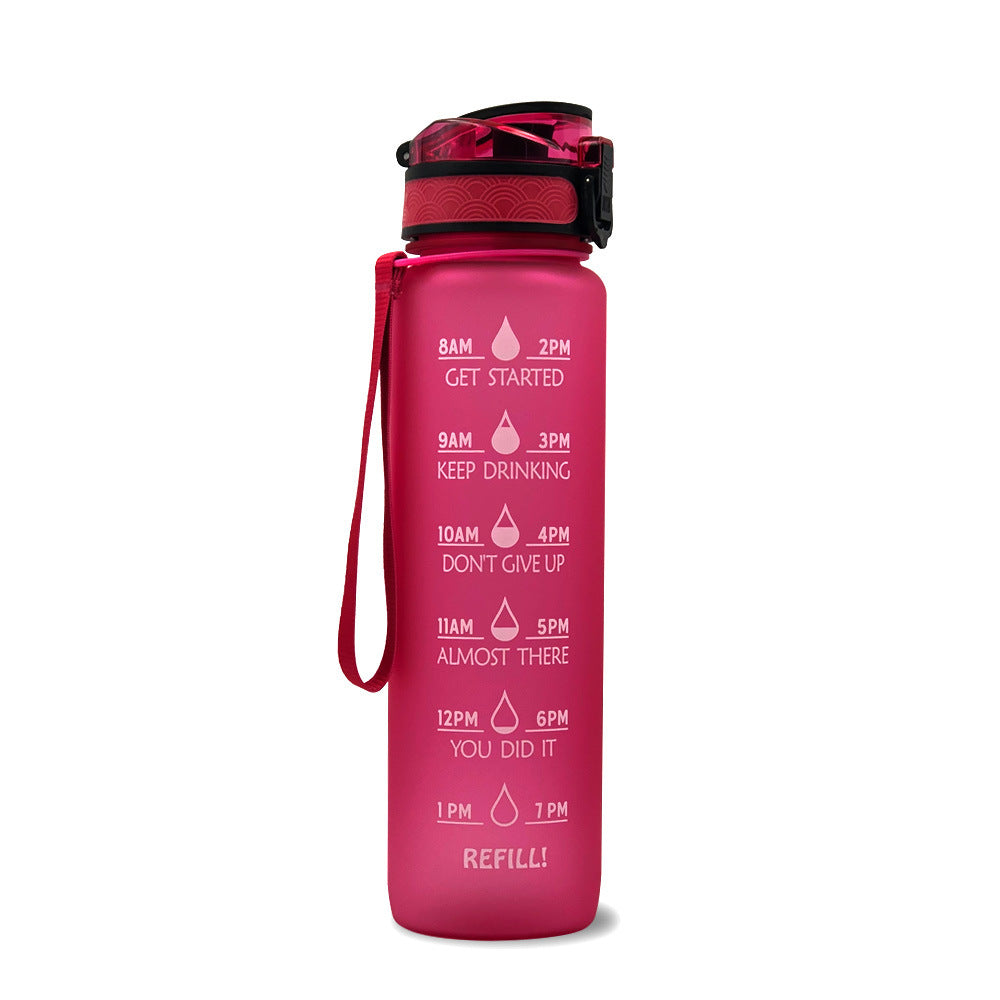 Pink water bottle with motivational time markers on a white background